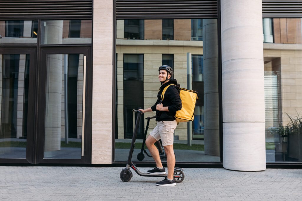 man commuting with electric scooter