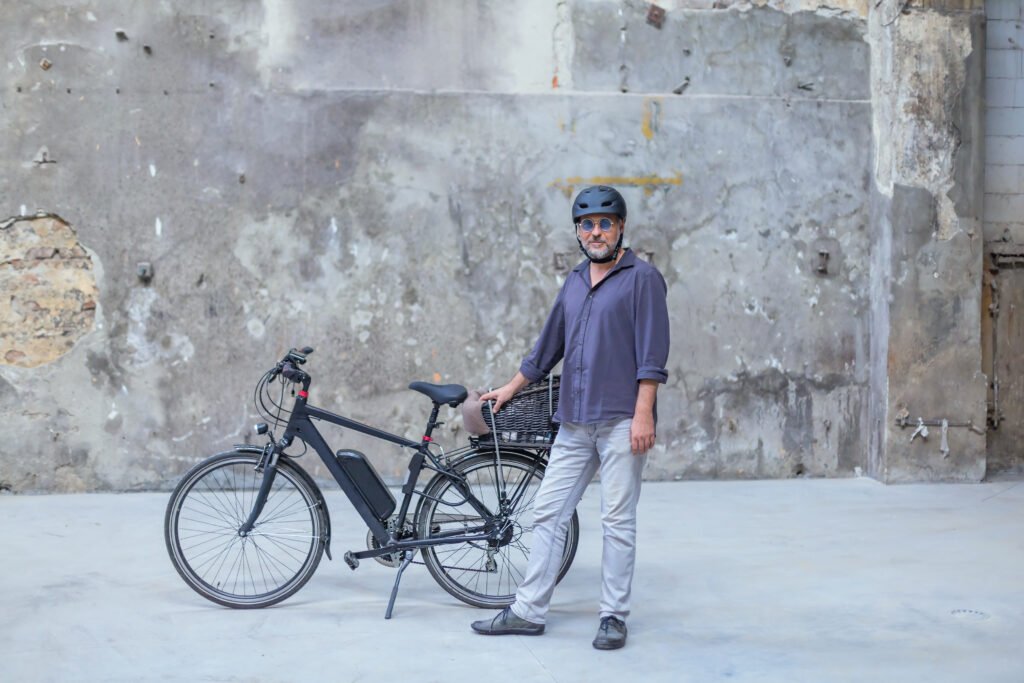 man standing in front of electric bike