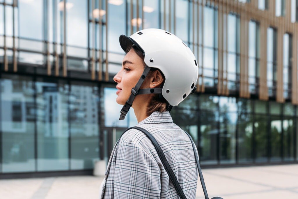 Best electric bike accessories – woman wearing a safety-rated e-bike helmet
