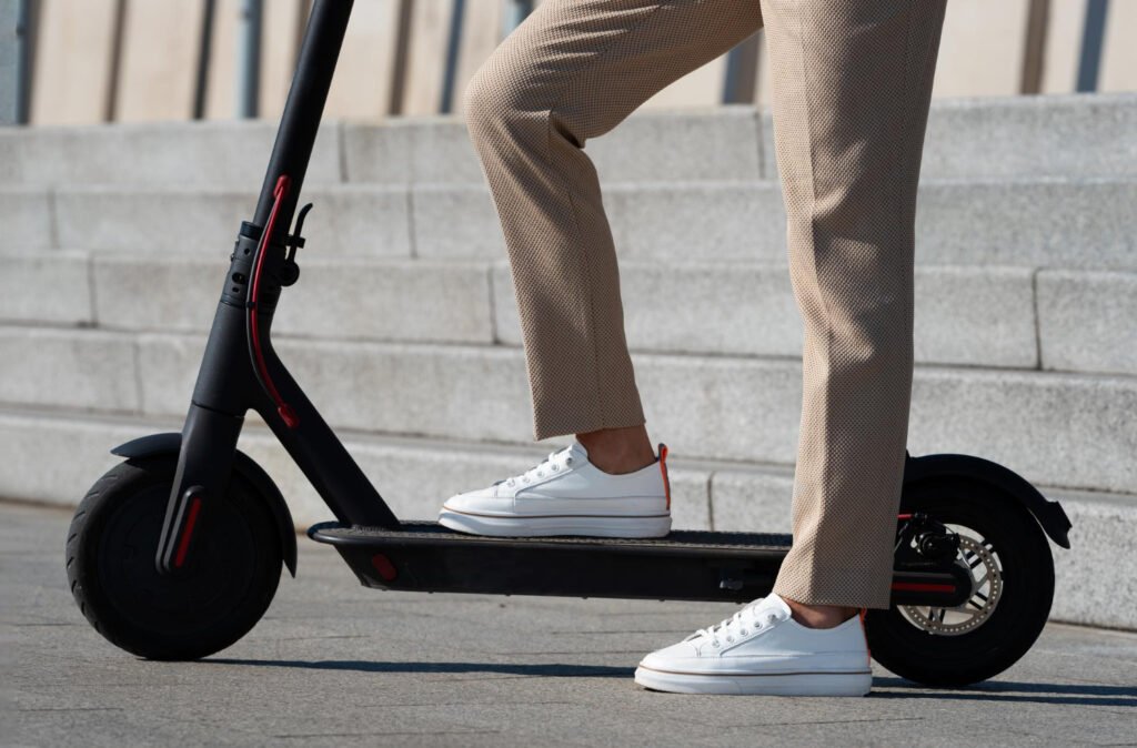 Woman riding an Electric scooter Woman riding an E-scooter in the city