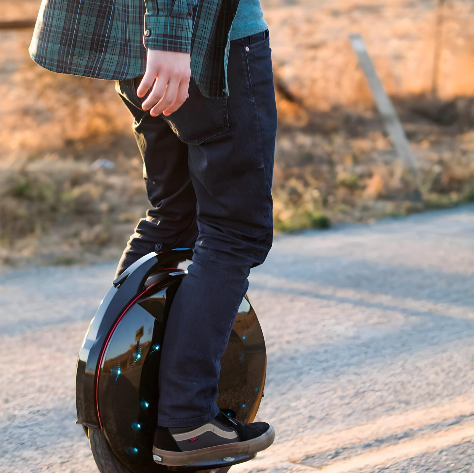 InMotion V8F electric unicycle Young man commuting on the InMotion V8F electric unicycle with 1000W motor and LED side lights