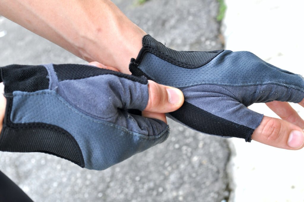 Close up of man wearing cycling gloves Close up of man wearing cycling gloves